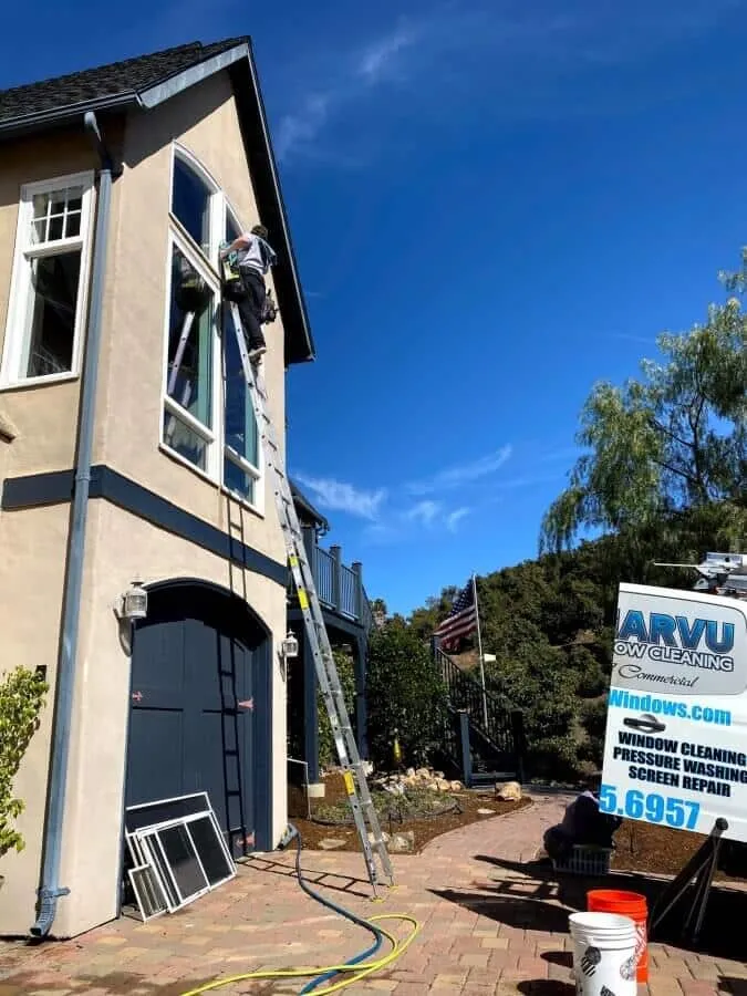 Clearvu technician using professional window cleaning equipment in Murrieta
