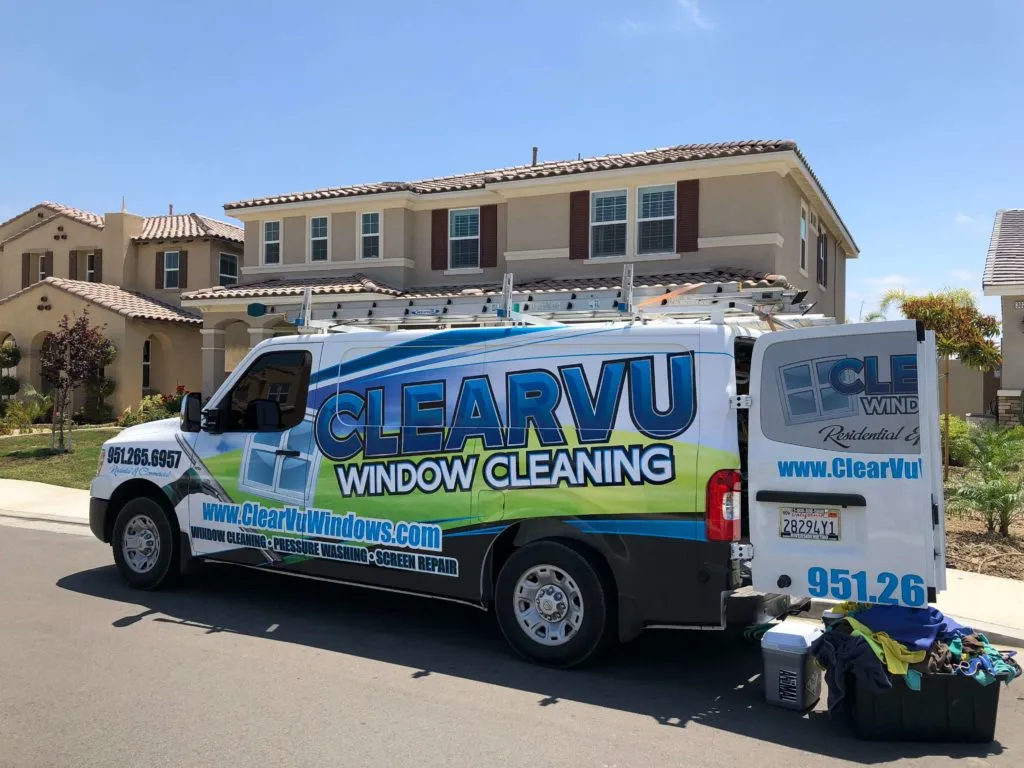 Clearvu team member cleaning windows at a Murrieta home