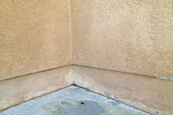 Restored concrete patio after commercial pressure washing treatment