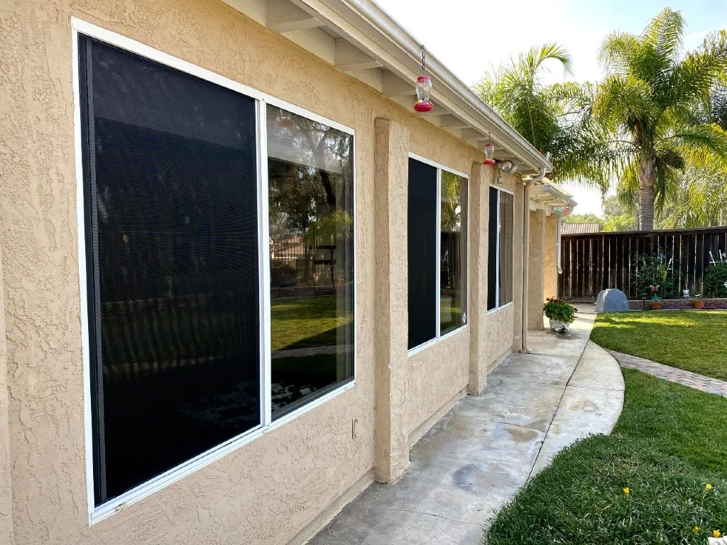 Window screen being measured and assembled at a Menifee home