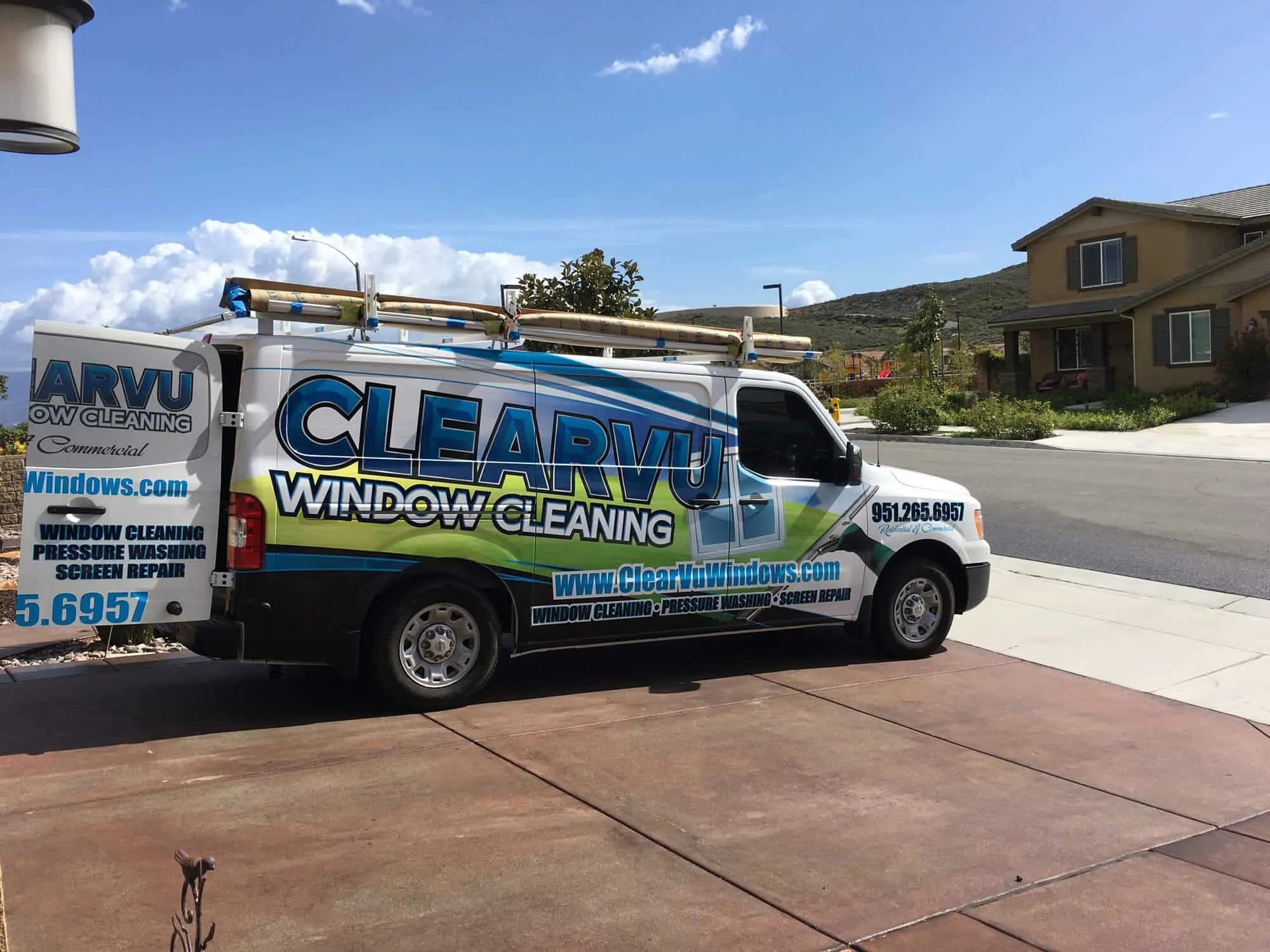 Technician replacing a damaged window screen at a Menifee residence