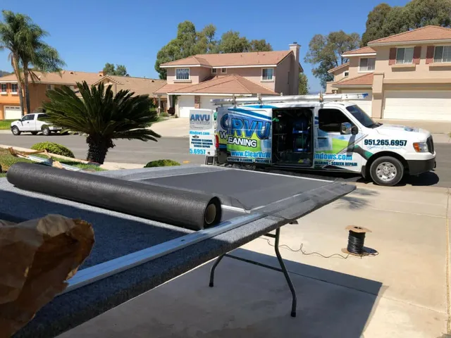 Window screen being removed from a residential window